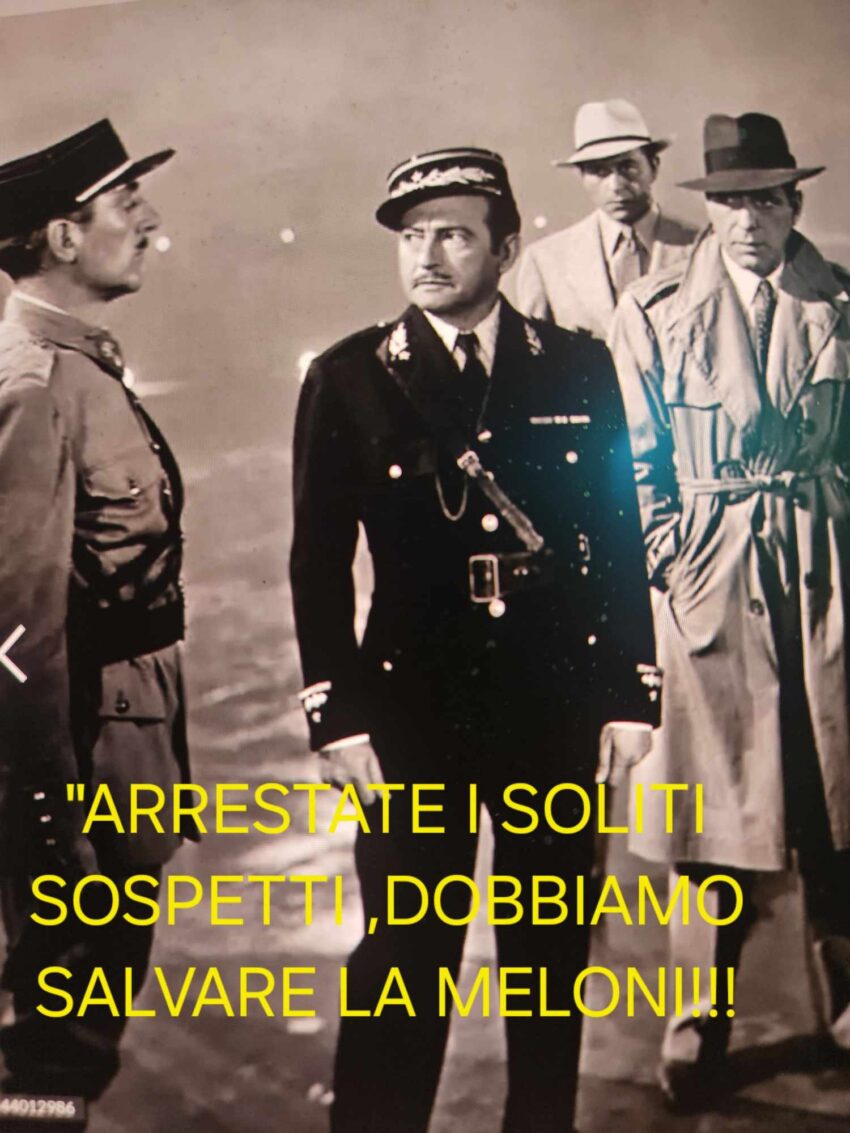 A vintage photo of men in uniforms during an arrest scene.